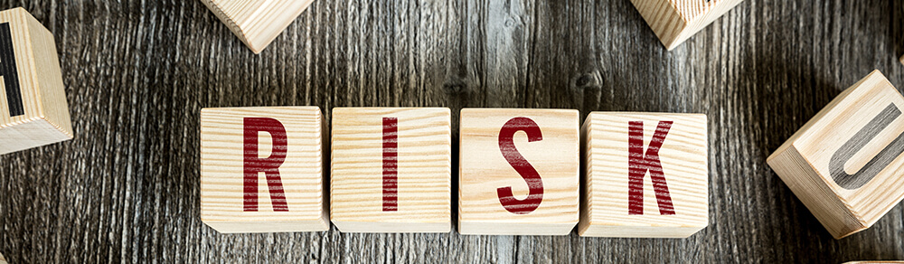 Wooden Blocks with the text: Risk