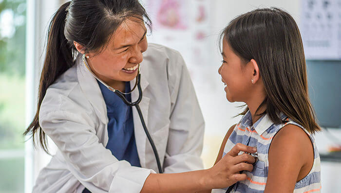 Nurse Listening to the Child's Heartbeat