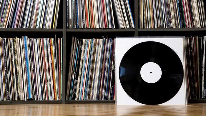 what-are-the-dimensions-of-a-record-album-cover_26f078a8-a374-4482-97dc-1226c4730f1a Record on floor next to shelves of records
